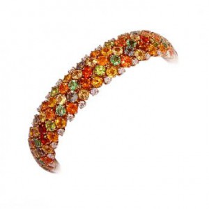 "Meteore" bracelet in 18k yellow gold with multicoloured sapphires.