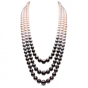 "Twilight" necklace in 18k white gold with 3 strands of 8-14mm Akoya and Tahitian pearls.