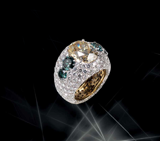Cassetti ring set in yellow gold with fancy yellow, green and white diamonds
