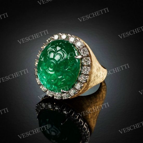 Esmeralda ring set with carved emerald and brilliant-cut diamonds in yellow gold