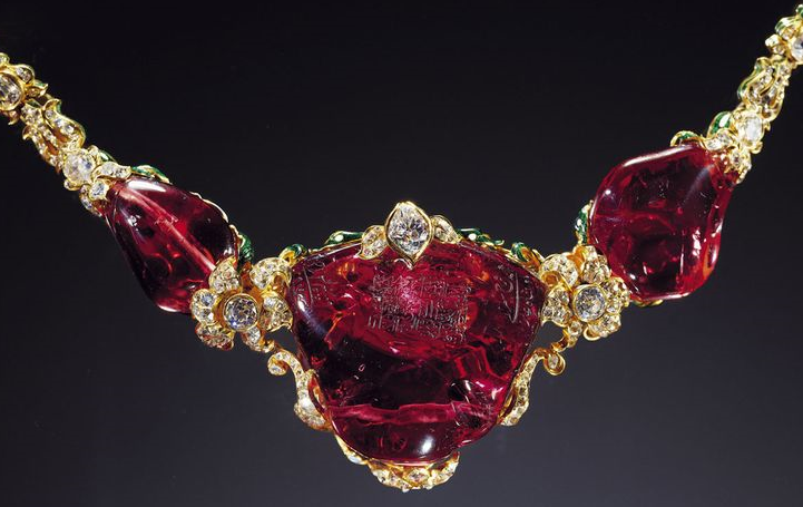 The Timur ruby (also Khiraj-i-alam, "Tribute to the World") is an unfaceted, 361-carat polished red spinel gemstone set in a necklace in 1853