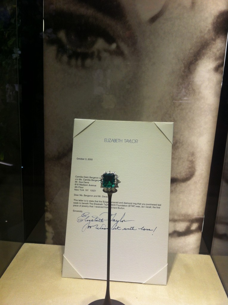 Ring in platinum with emerald and diamonds, 1962. It was the first jewel that Elizabeth Taylor received from Richard Burton in Rome during the filming of Cleopatra. The actress sold it in 2002 at a charity auction for "The Elisabeth Taylor AIDS Foundation" and in a letter addressed to the new owners, Taylor wrote: "Wear it with love!". In the former collection of Elizabethe Taylor. Bulgari Heritage Collection.