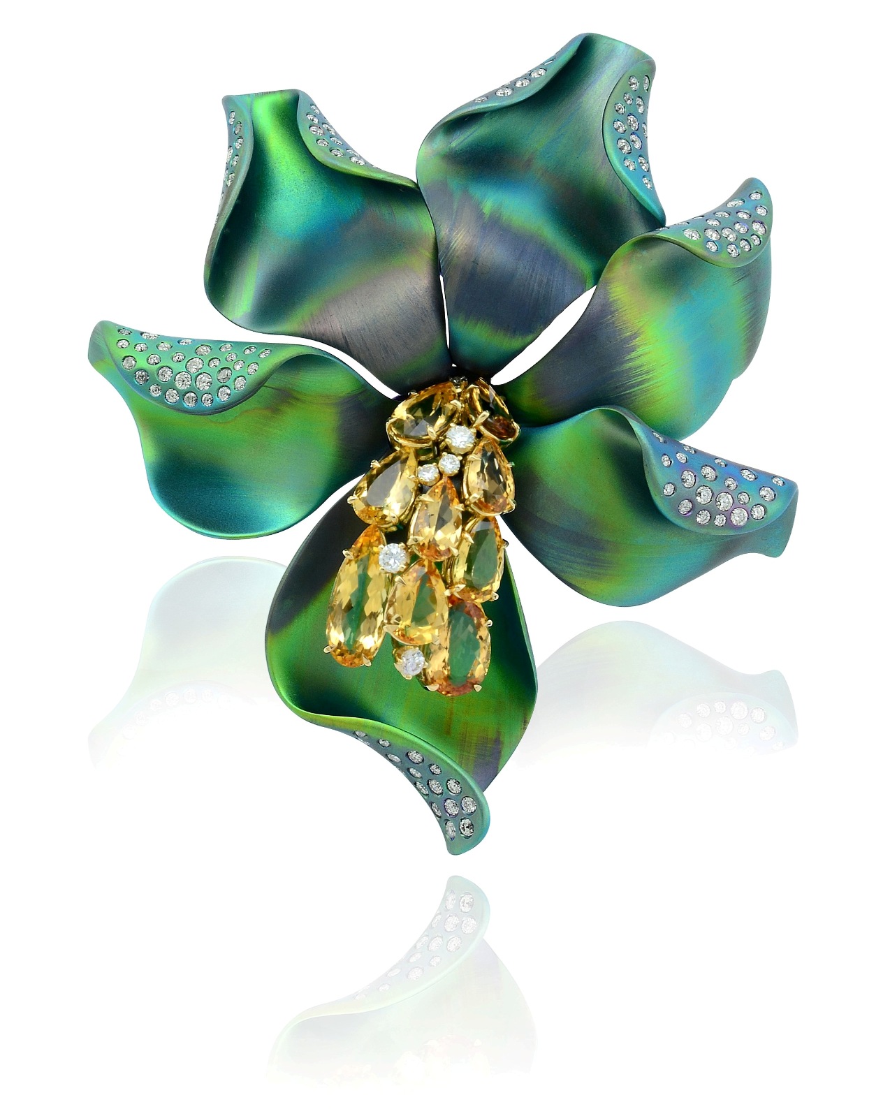Flower brooch set in titanium with pear shaped sapphires and diamonds, Margherita Burgener